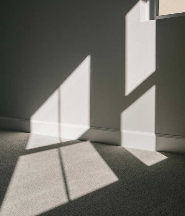 A calm and spacious room with soft lighting, ideal for exercise.