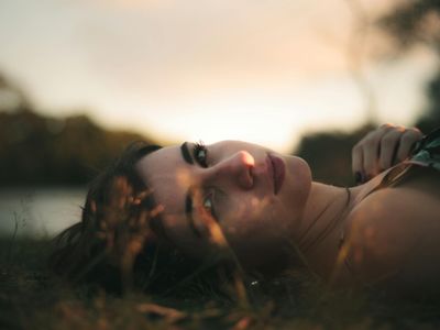 Person resting after a workout, looking serene.